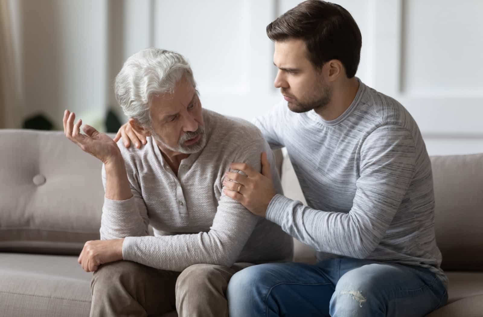 An adult child talking to their mature parent about transitioning to community living.